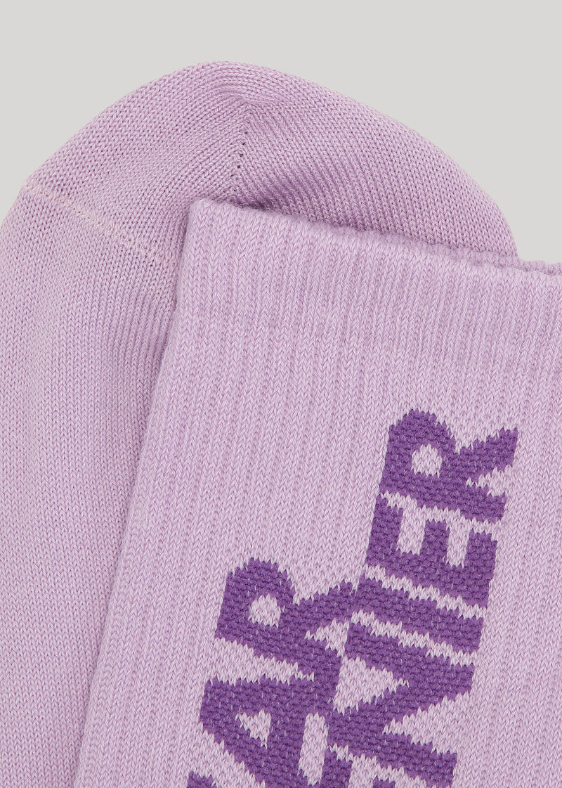 Dear Denier crew sports socks with embroidered DEAR DENIER logo on one side and EARTH ACTVSM logo on the other side